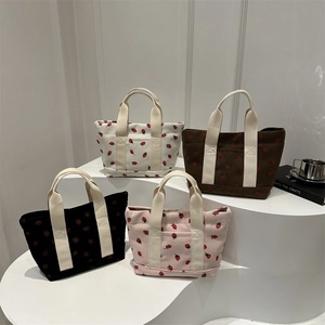 Japanese style strawberry print corduroy tote bags in four versatile colors on white display