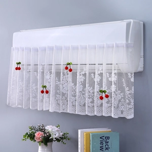 Close-up of white lace air conditioner cover featuring decorative 3D red cherry accents