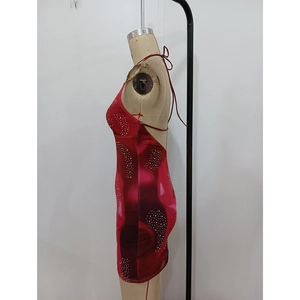 Side view detail of red printed mini dress with rhinestones and backless strap design