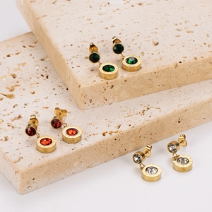 Minimalist Roman numeral stud earrings set with colored cubic zirconia in gold