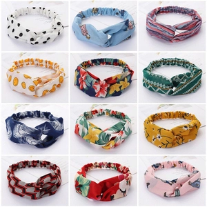 Set of 12 multi-patterned fabric twisted headbands with floral and geometric prints