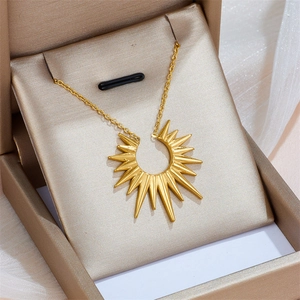 Minimalist gold stainless steel star pendant necklace displayed in a beige jewelry gift box