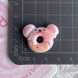 Detailed size view of pink resin mouse donut charm showing 2.5cm width on a grid mat