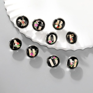 Fashionable floral alphabet brooch set with black base and gold letters for DIY bags