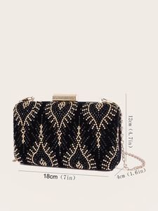 Macro detail of black evening clutch bag with gold studs and dimensions 18x12x4cm