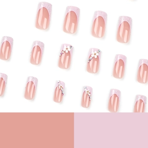 Pink French press-on nails with 3D white flowers, sparkling rhinestones and silver sequins