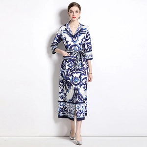 Blue and white porcelain print maxi dress with V-neck, waist tie, and 3/4 sleeves