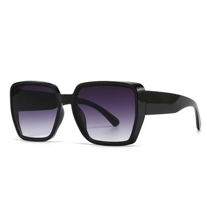Women's trendy oversized sunglasses with black frame and purple gradient lenses
