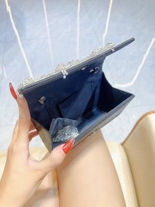 Black sequin evening bag with main compartment and metal chain strap interior view