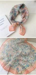 Detailed view of floral cotton linen scarf with pastel pink and blue botanical patterns