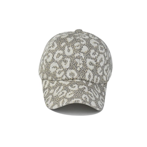 Detail of leopard print knitted baseball cap showing soft texture and stitching