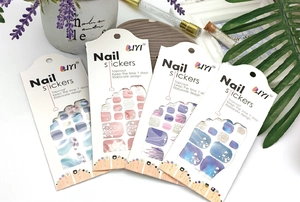 Detail of waterproof toenail stickers with marble and gold glitter patterns and 7-day wear