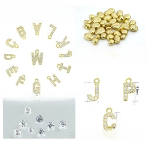 Detailed view of 18K gold plated copper initial pendants with micro-pave cubic zirconia