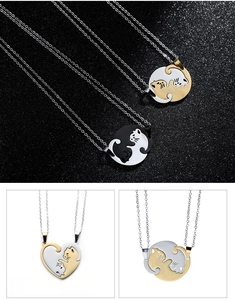 Detail of stainless steel cat puzzle necklace showing interlocking heart and round pendants