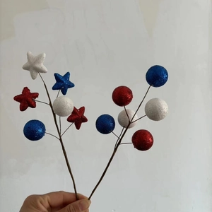 Detail of red white and blue glitter stars and foam balls for Independence Day decor