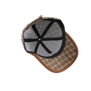 Plaid wool baseball cap for kids with brown leather trim and cartoon bear lining