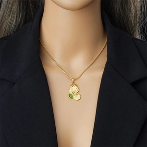 Vintage gold butterfly necklace with green oval cat-eye stone on a snake chain