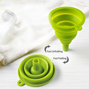 Collapsible green silicone kitchen funnel showing folded 1.7cm thickness and expanded state