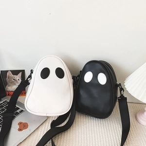 Detailed view of cartoon ghost crossbody bags in black and white PU leather materials