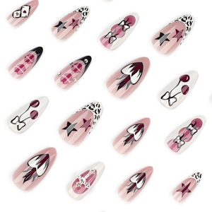 Y2K style almond fake nails with leopard print, stars, hearts, and 3D cross charms