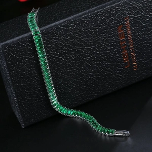 Classic silver-tone tennis bracelet with emerald green rectangular zircon stones