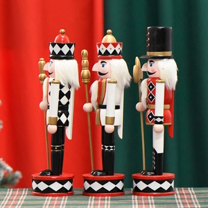 Three-piece walnut soldier nutcracker set in red and black plaid for Christmas decor