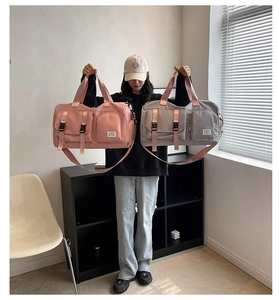 Pink and gray travel bags with adjustable straps and multiple functional compartments