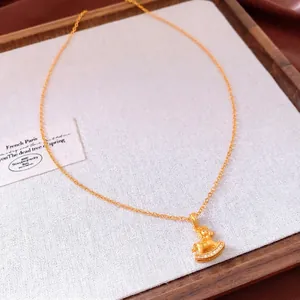 Gold-plated rocking horse pendant necklace with white zircon inlay on O-chain