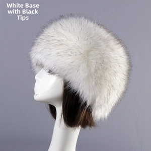Detail view of white faux fur winter hat with black tips on a mannequin side profile