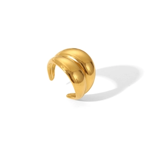 Detail of wide wavy gold band ring with polished surface on white background