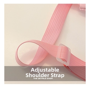 Detail of pink woven fabric shoulder strap with a clear adjustable buckle for kids waist bag