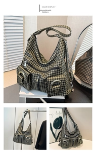 Houndstooth patterned tote bag featuring large front pockets with decorative metal rings