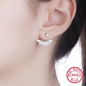 Close-up of S925 sterling silver hoop earrings with white cubic zirconia on the earlobe