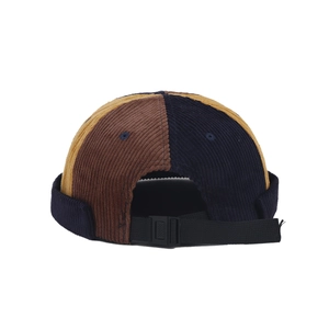 Three-tone patchwork corduroy docker cap in brown, navy and yellow with adjustable strap