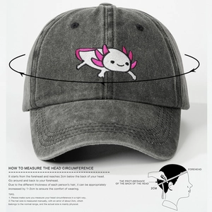 Dark grey washed denim baseball cap with pink axolotl embroidery and head size guide