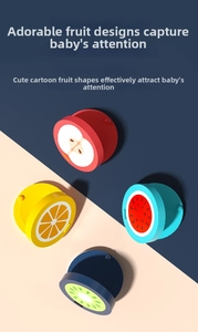 Close-up of colorful wooden fruit castanets including apple, orange, watermelon and kiwi