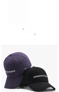 Detail of cotton baseball caps with SMOOHTMOO embroidery in sky blue, purple, and black