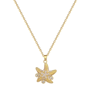 Elegant gold starfish pendant necklace with sparkling rhinestones on a fine chain
