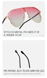 Close-up of golden metal frame sunglasses with gradient pink lenses and black tips