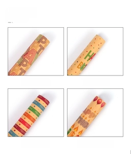 Detailed grid of four birthday kraft wrapping paper rolls with stars and balloon motifs