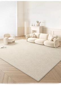 Detailed close-up of cream woven rug texture with reinforced edges in a living room