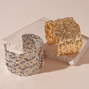 Chic gold and silver irregular metallic wide open bangles with lava texture finish