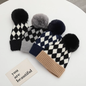 Knit baby beanie hats with plaid pattern and faux fur pom-pom in four neutral colors