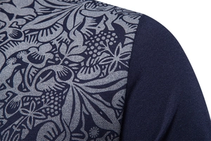 Detail of navy blue polo shirt with grey floral print on pique knit cotton fabric