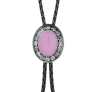 Detailed close-up of a silver bolo tie with ornate engraving and pink agate stone