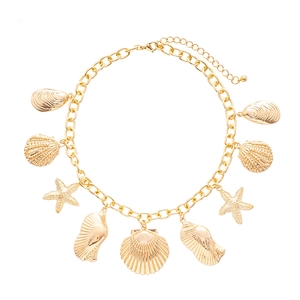 Gold ocean-themed necklace with starfish and shell pendants on chunky chain links