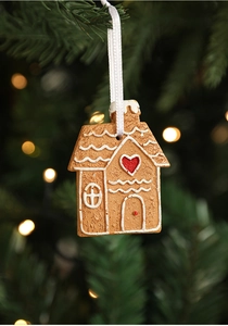Detailed resin gingerbread house Christmas tree ornament with white ribbon and red heart detail