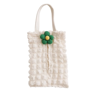Detail of ivory bubble fabric car tissue holder with 3D sunflower decoration