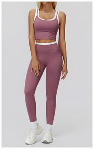Detail of high-waisted dusty rose yoga set with contrast white trim and rib texture