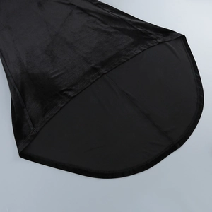 Detail of black evening gown showing contrast between velvet texture and smooth lining